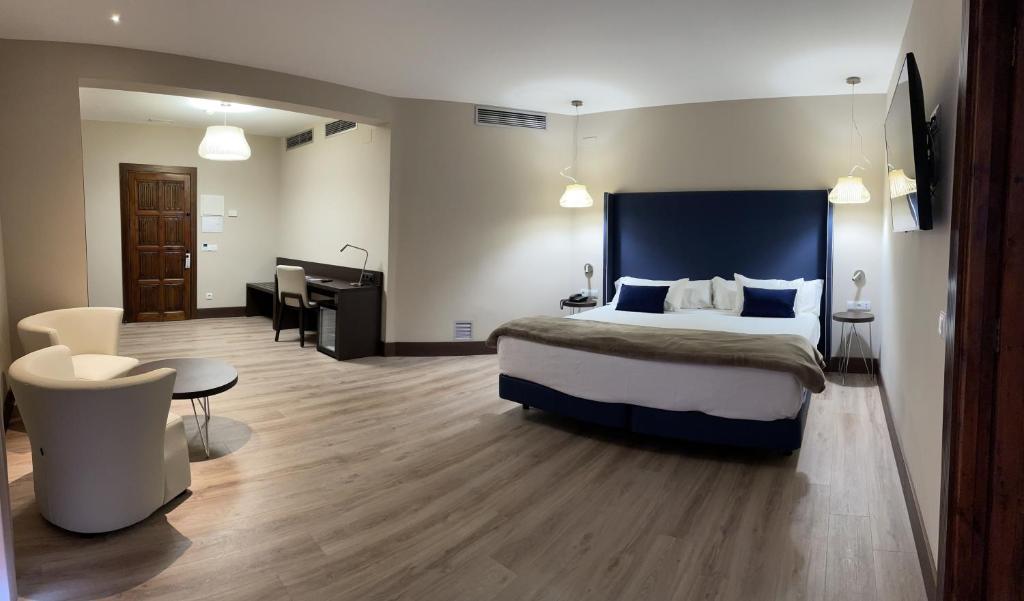 Postel nebo postele na pokoji v ubytování Hotel Maria Cristina