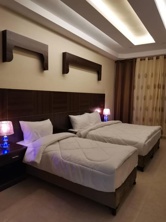 Postel nebo postele na pokoji v ubytování Nice View Hotel فندق الأطلالة الجميلة للعائلات فقط