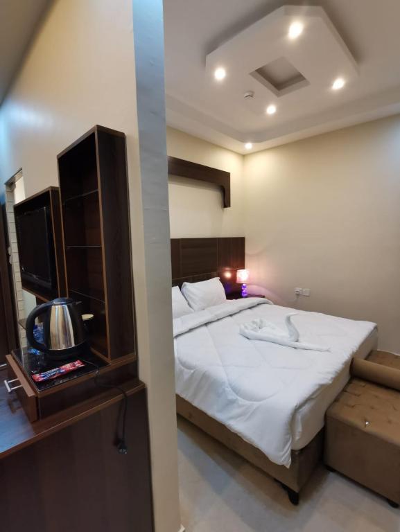 Postel nebo postele na pokoji v ubytování Nice View Hotel فندق الأطلالة الجميلة للعائلات فقط