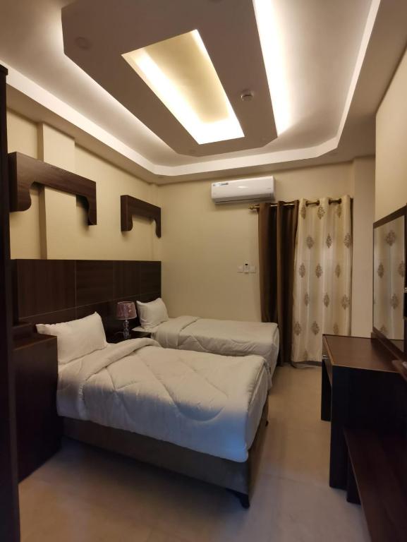 Postel nebo postele na pokoji v ubytování Nice View Hotel فندق الأطلالة الجميلة للعائلات فقط