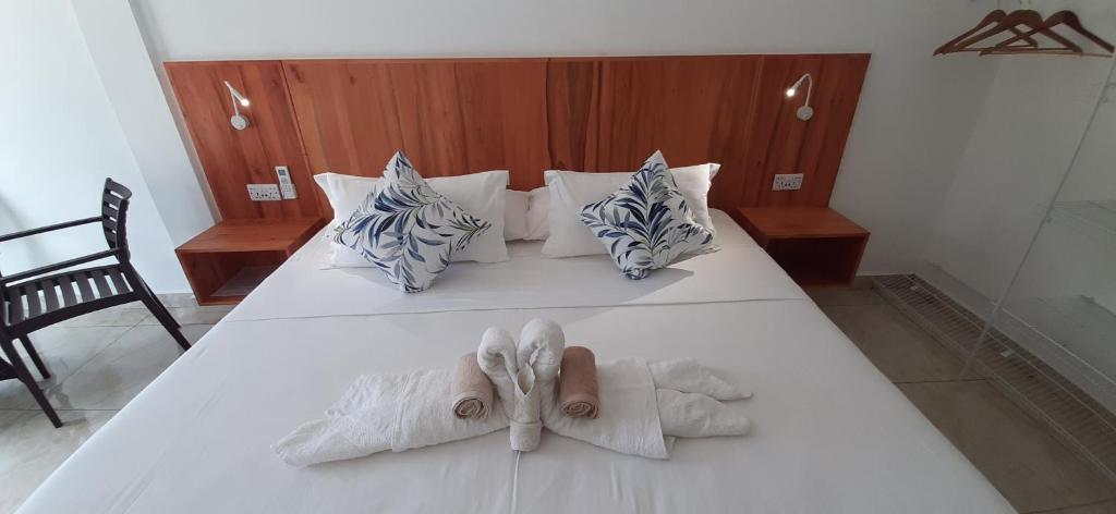 Postel nebo postele na pokoji v ubytování Jamelah Beach Guest House