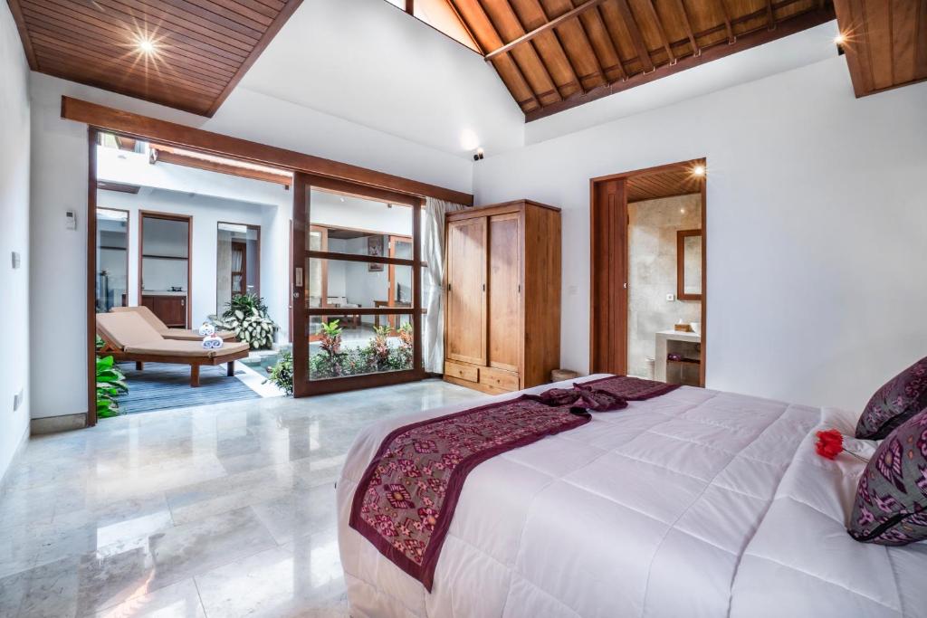 Postel nebo postele na pokoji v ubytování Gigimas Private Villa