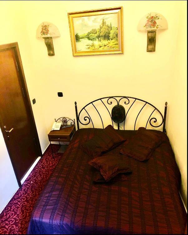 Postel nebo postele na pokoji v ubytování Voila Inn