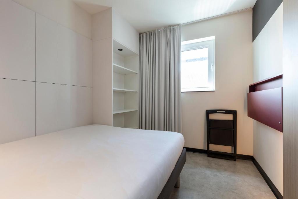 Postel nebo postele na pokoji v ubytování ibis budget Blankenberge