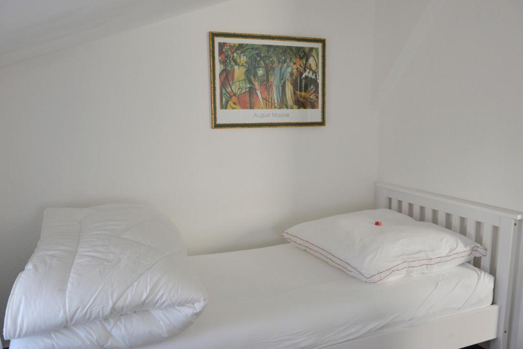 Postel nebo postele na pokoji v ubytování Wohnung Steuerbord