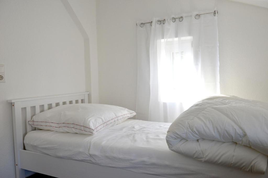 Postel nebo postele na pokoji v ubytování Wohnung Steuerbord