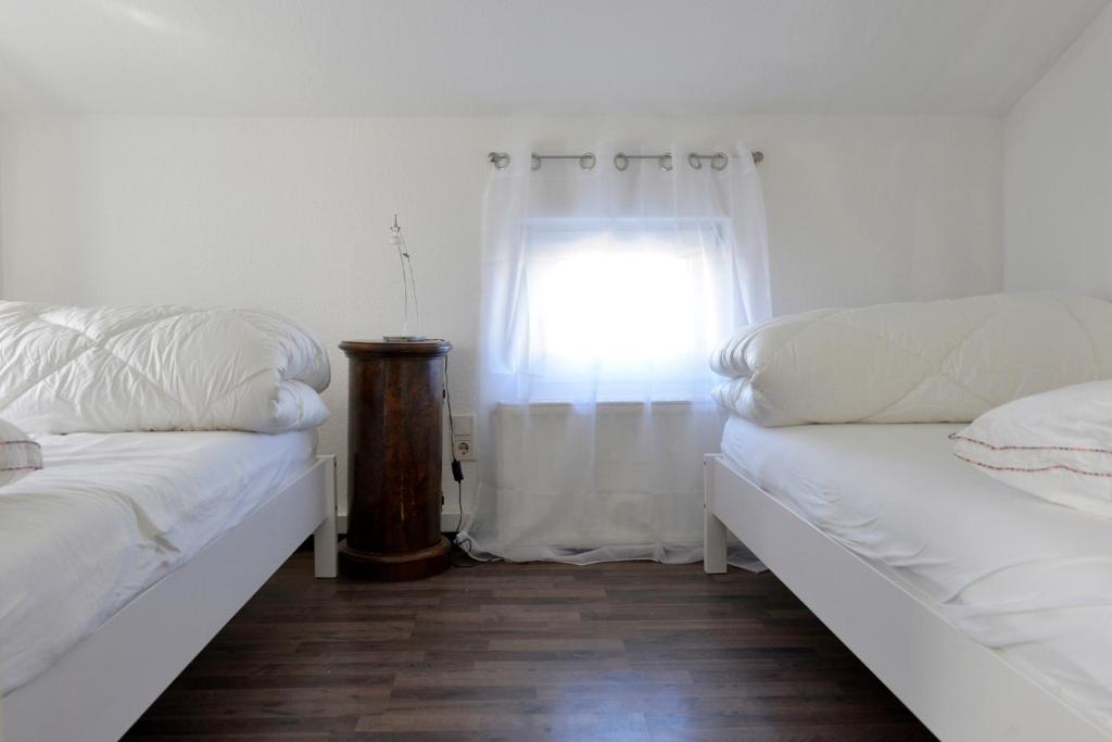 Postel nebo postele na pokoji v ubytování Wohnung Steuerbord
