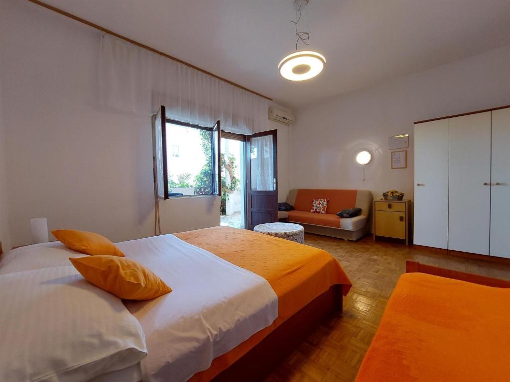 Postel nebo postele na pokoji v ubytování Apartments Faran