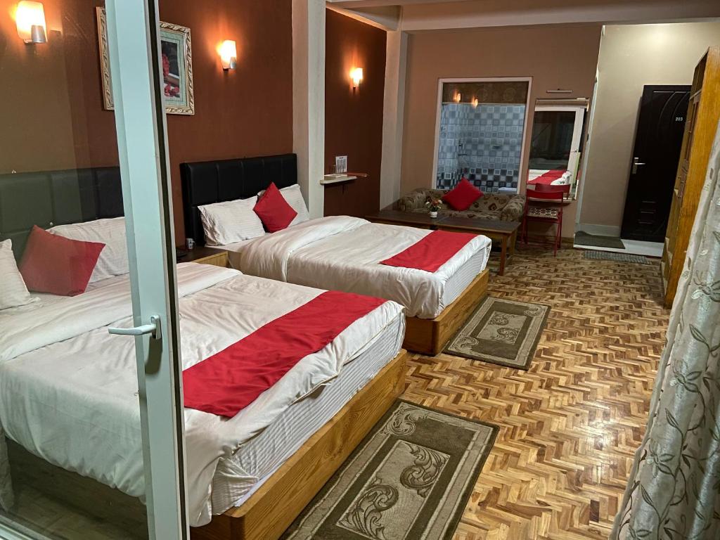 Postel nebo postele na pokoji v ubytování Hidden Gem Residency