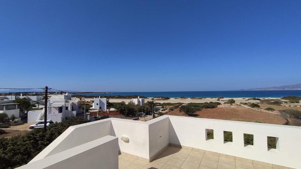 a white house with a view of the ocean at Glyfada House in Kastraki Naxou