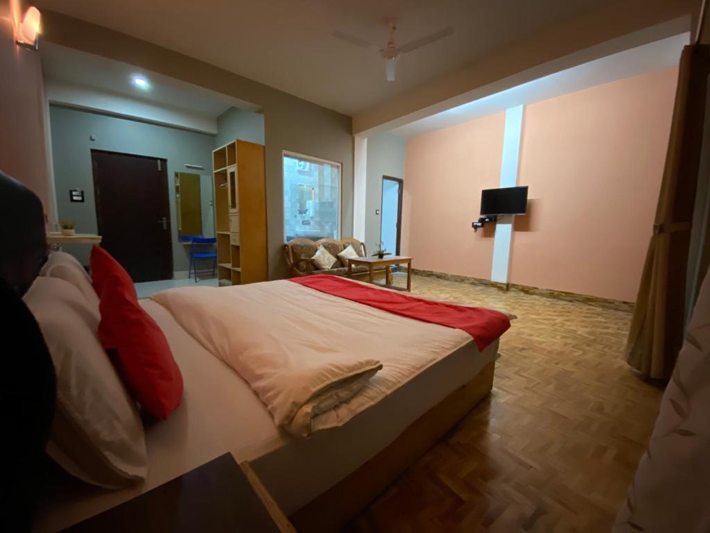 Postel nebo postele na pokoji v ubytování Hidden Gem Residency