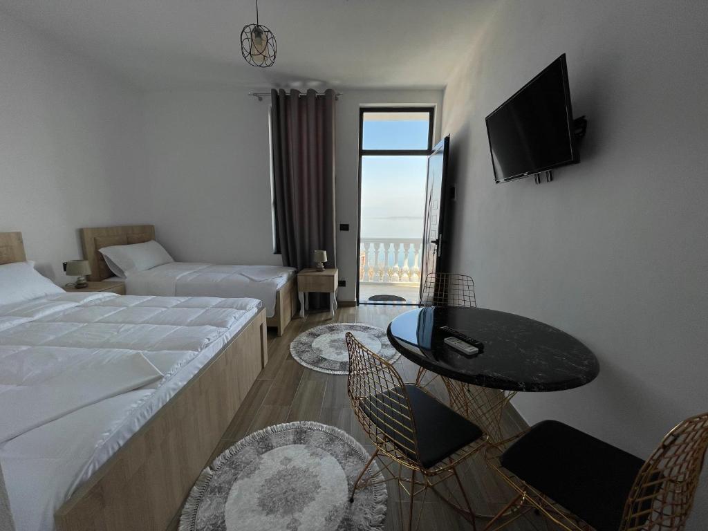 Postel nebo postele na pokoji v ubytování four generation hotel