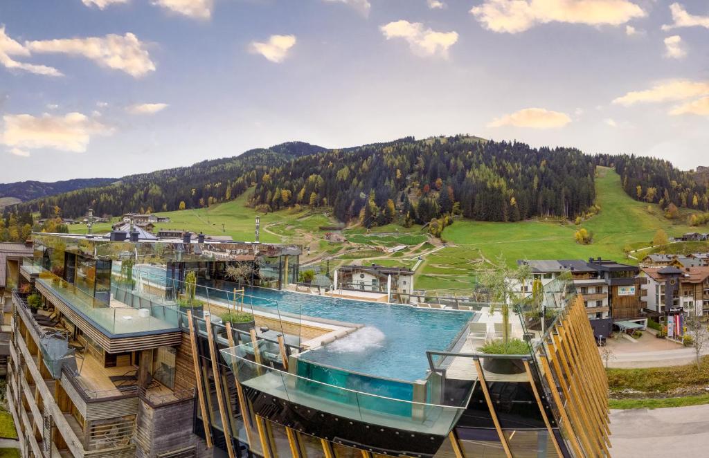 arial view of a resort with a water slide at Hotel Salzburger Hof Leogang in Leogang