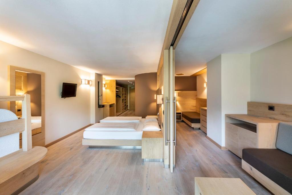 Postel nebo postele na pokoji v ubytování Design & Suite Hotel Ciarnadoi