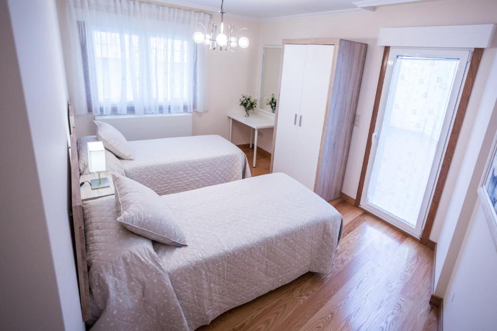 Posteľ alebo postele v izbe v ubytovaní Casa Goros