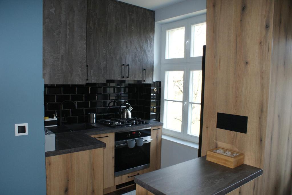 Kuchyňa alebo kuchynka v ubytovaní APARTAMENT CENTRUM OLSZTYNA 2