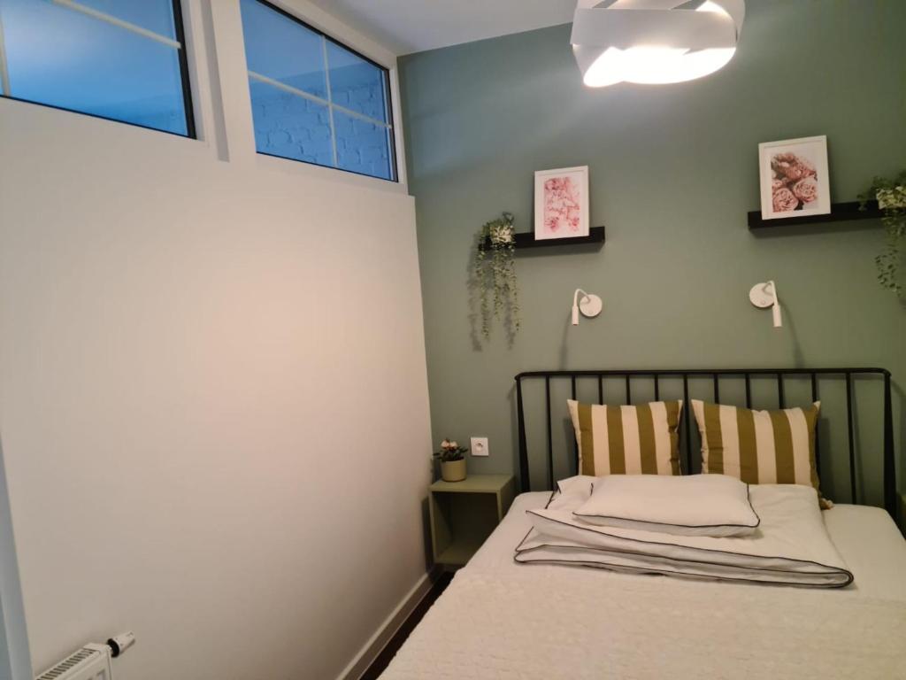 Posteľ alebo postele v izbe v ubytovaní APARTAMENT CENTRUM OLSZTYNA 2