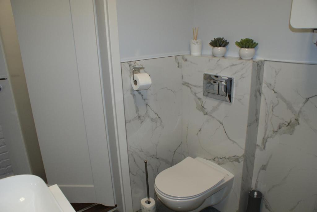 Kúpeľňa v ubytovaní APARTAMENT CENTRUM OLSZTYNA 2