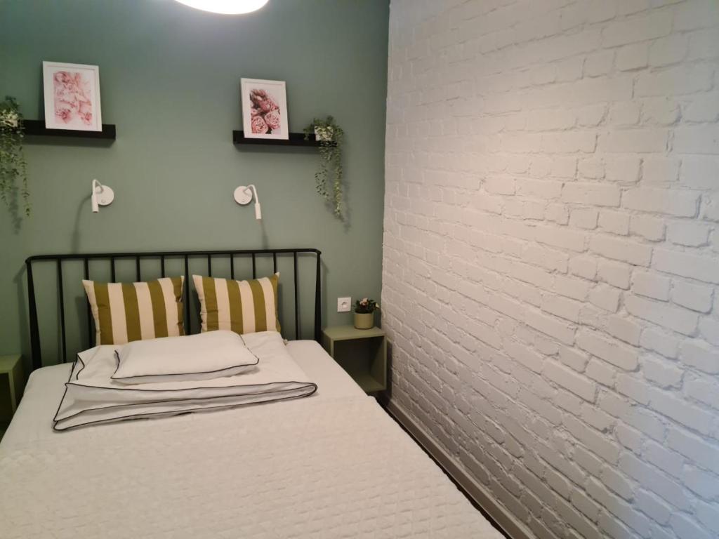 Posteľ alebo postele v izbe v ubytovaní APARTAMENT CENTRUM OLSZTYNA 2