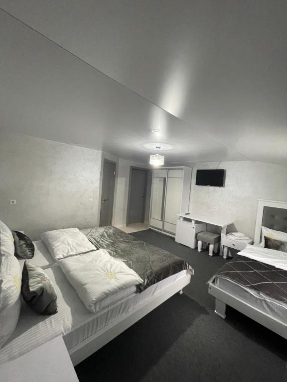 Postel nebo postele na pokoji v ubytování Guest House Turda