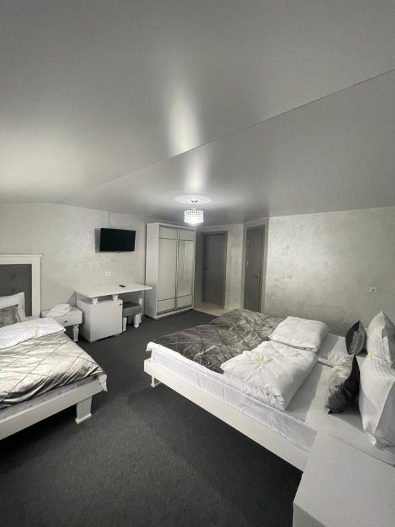 Postel nebo postele na pokoji v ubytování Guest House Turda