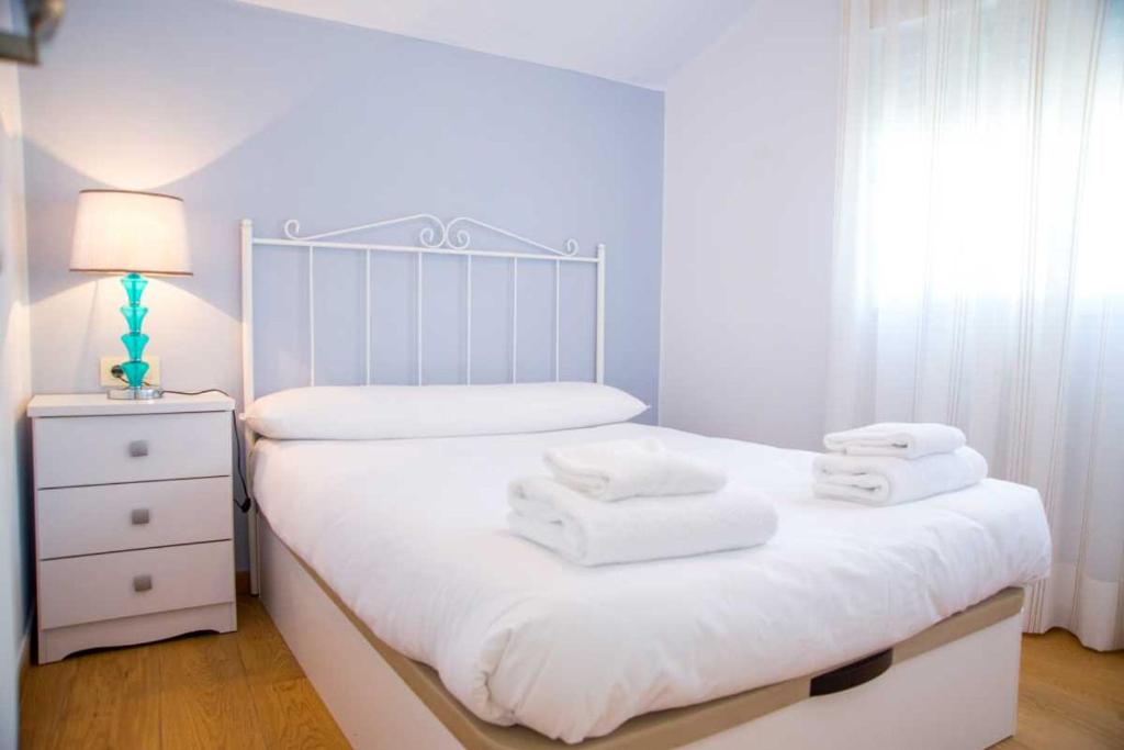 Postel nebo postele na pokoji v ubytování Ático Welcome Playa Panadeira