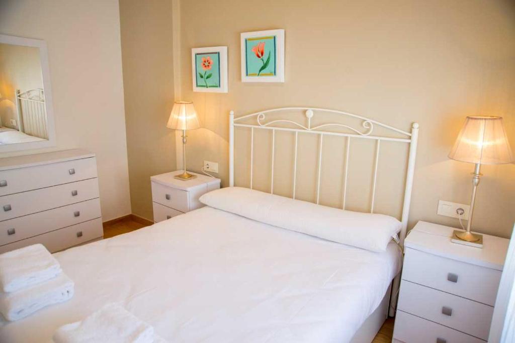 Postel nebo postele na pokoji v ubytování Ático Welcome Playa Panadeira