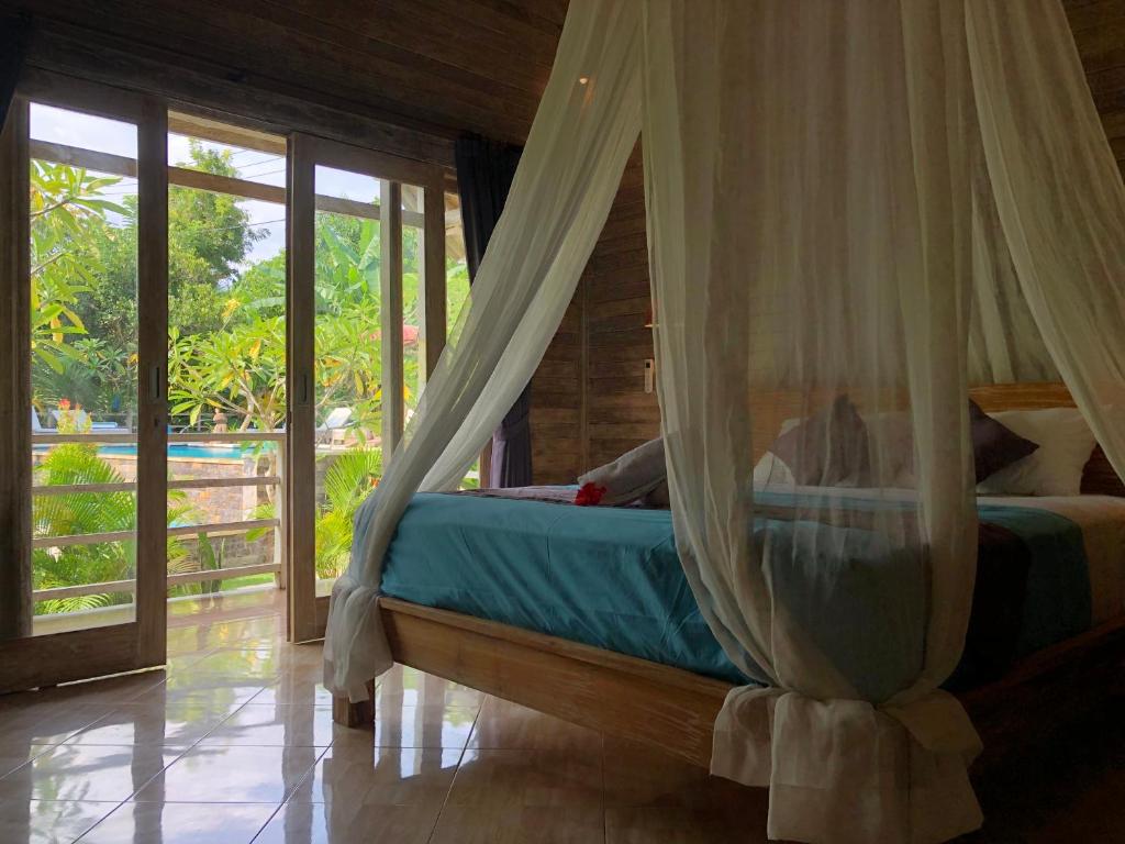 Postel nebo postele na pokoji v ubytování Le Biu garden View