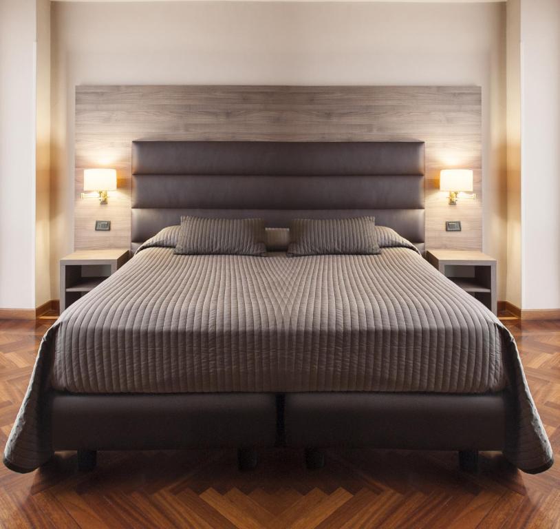 Postel nebo postele na pokoji v ubytování Hotel San Giorgio