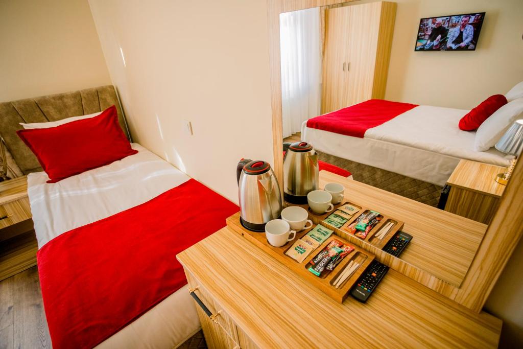 A bed or beds in a room at Gülec Konak Hotel
