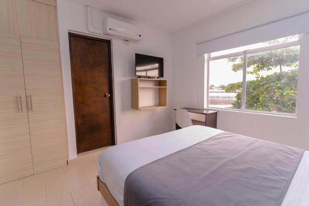 Postel nebo postele na pokoji v ubytování Hotel Plataneras Plaza