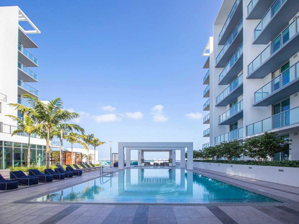 a swimming pool in the middle of a building at Desing district, great apartment in Miami