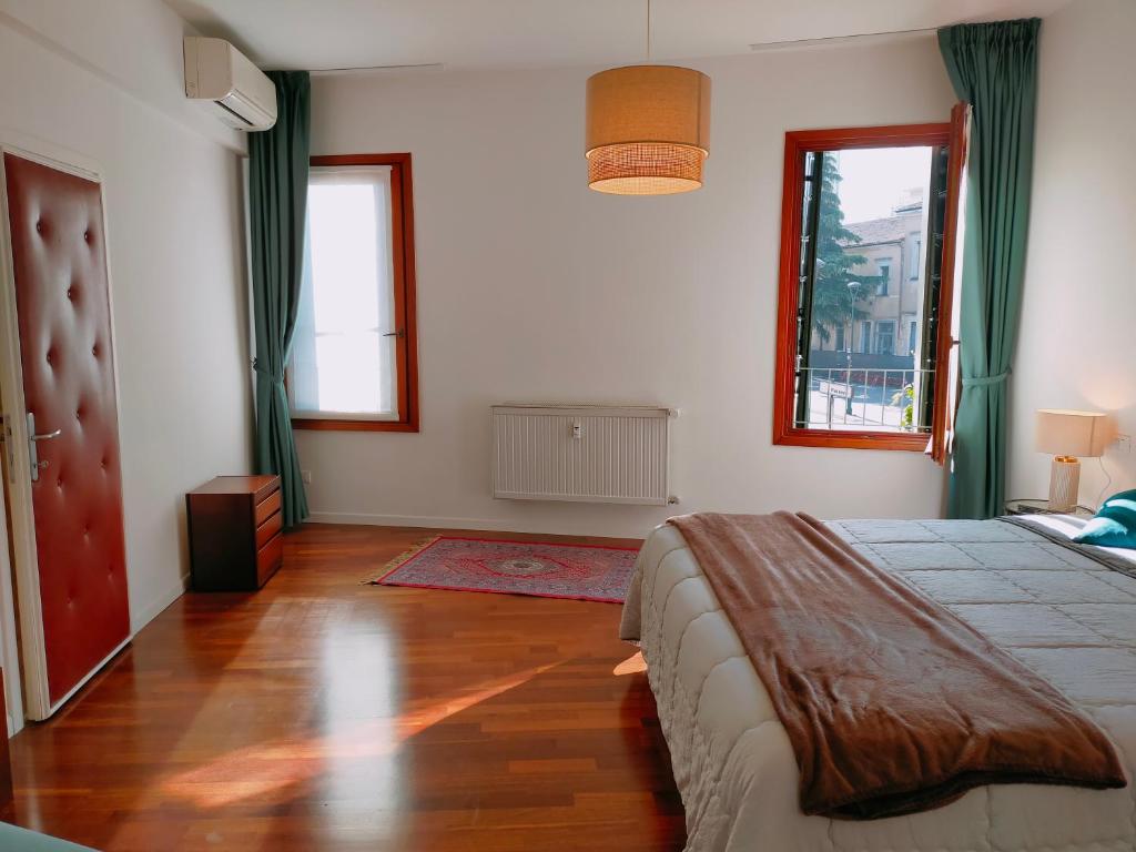 A bed or beds in a room at Ca' Palazzo