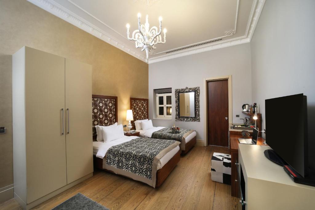 Cama ou camas em um quarto em The Story Hotel Pera