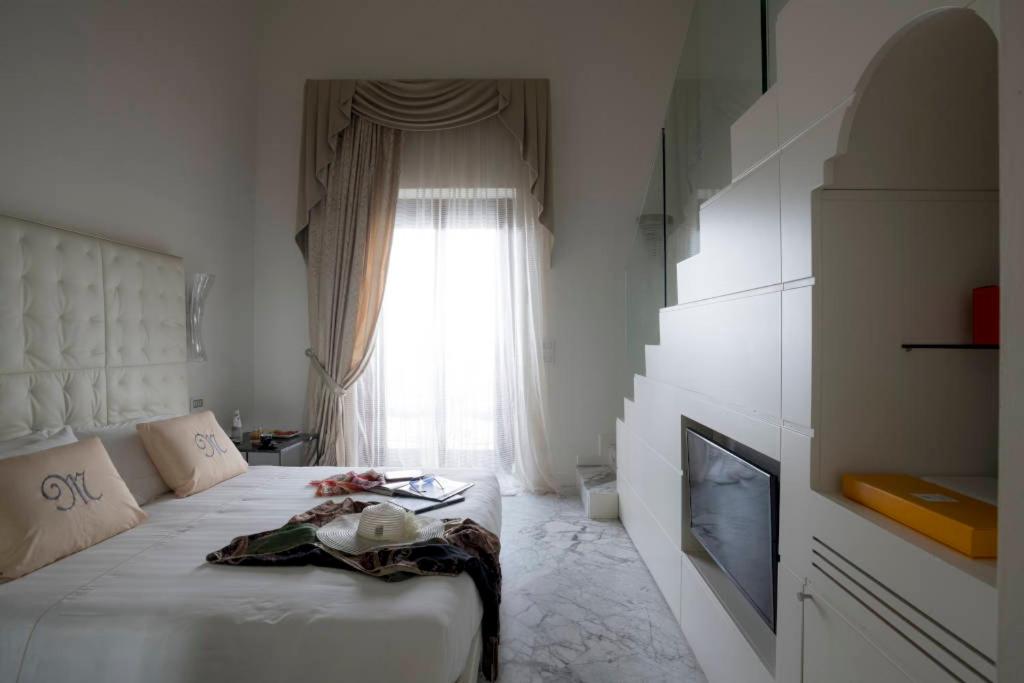 Postel nebo postele na pokoji v ubytování Hotel Metropole Taormina