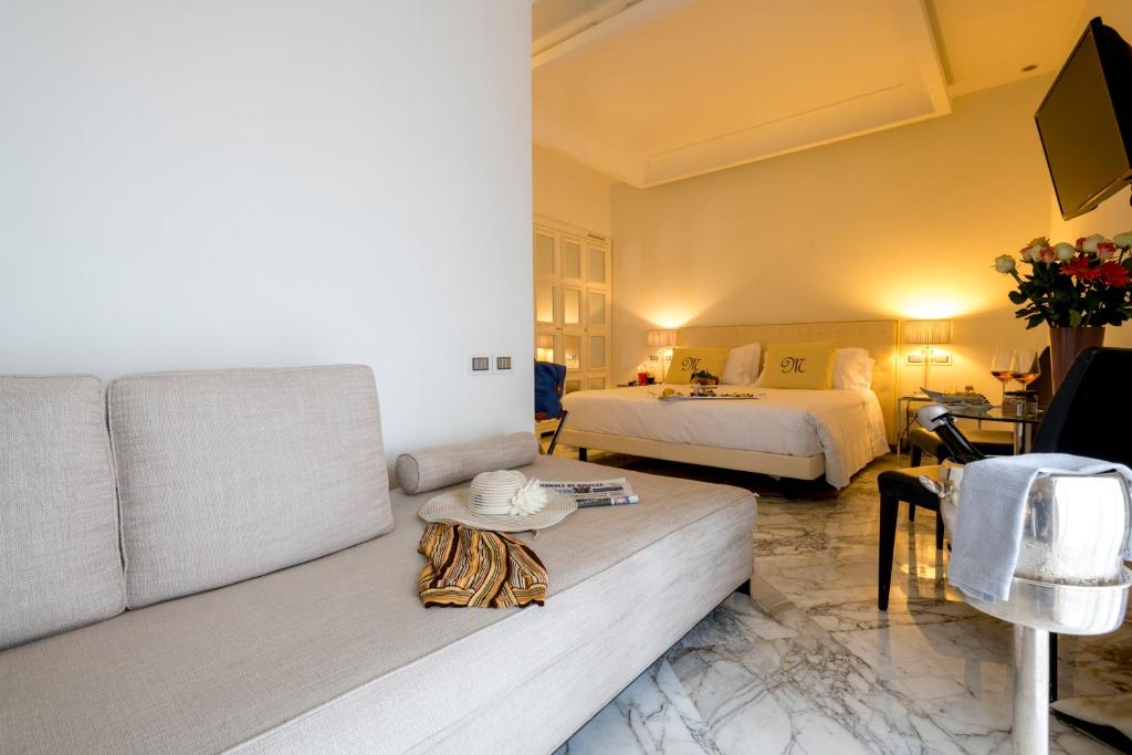 Postel nebo postele na pokoji v ubytování Hotel Metropole Taormina