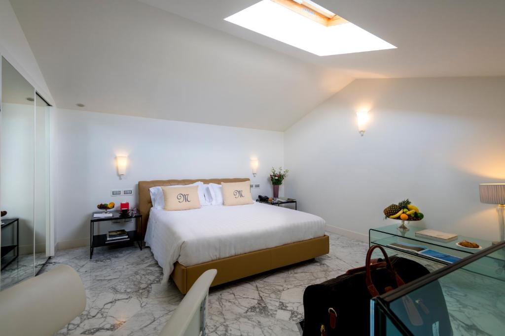 Postel nebo postele na pokoji v ubytování Hotel Metropole Taormina