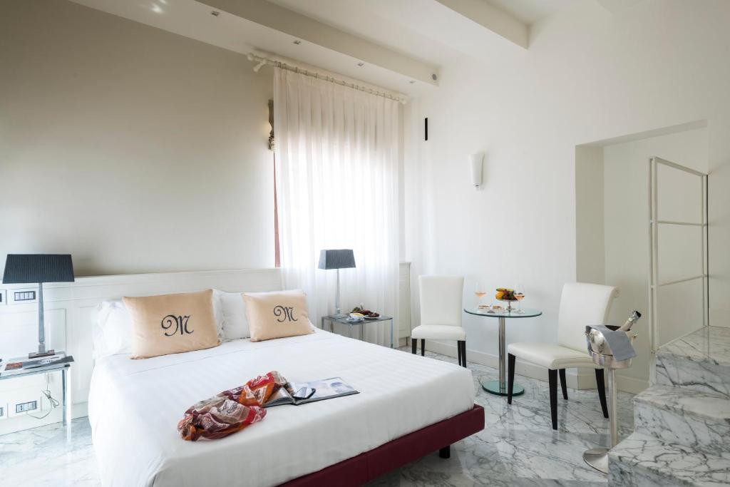 Postel nebo postele na pokoji v ubytování Hotel Metropole Taormina
