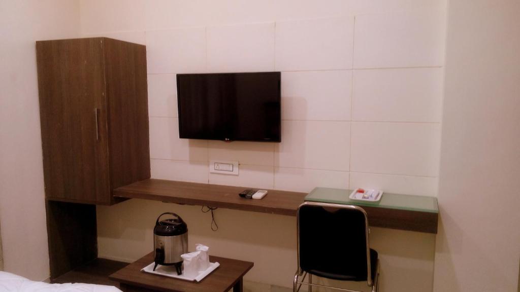 TV a/nebo společenská místnost v ubytování Hotel City Inn