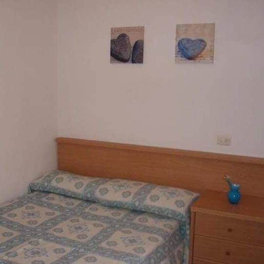 Postel nebo postele na pokoji v ubytování Apartamento Nuria Plaza San Isidro