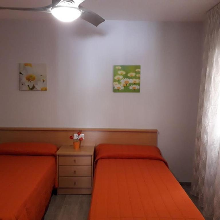 Postel nebo postele na pokoji v ubytování Apartamento Nuria Plaza San Isidro