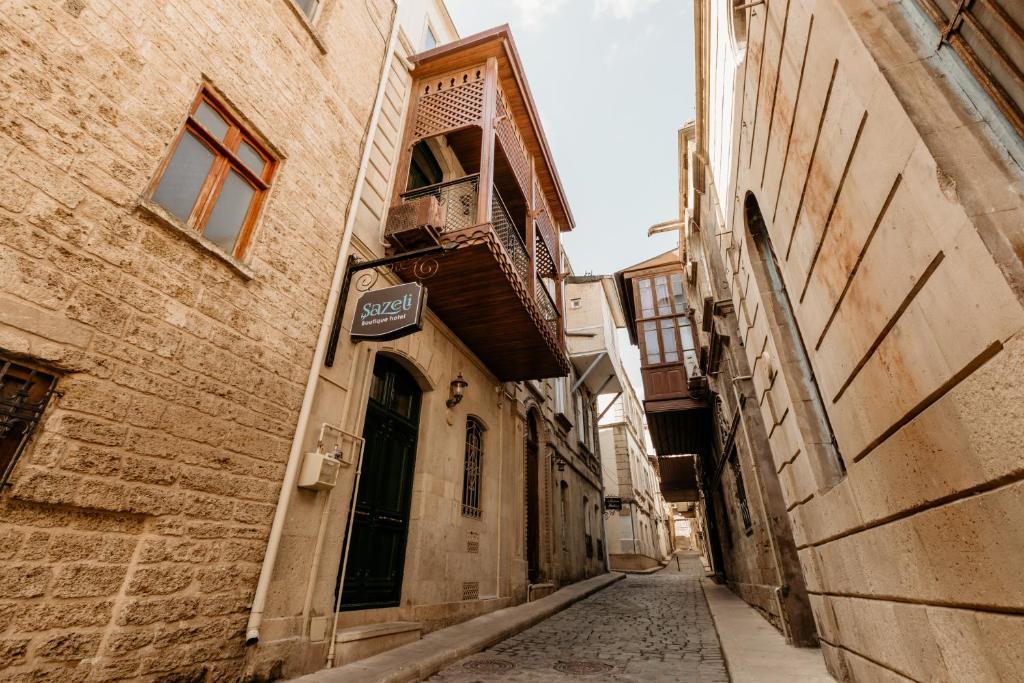 an alley in an old town with a building at Sazeli Boutique Hotel in Baku