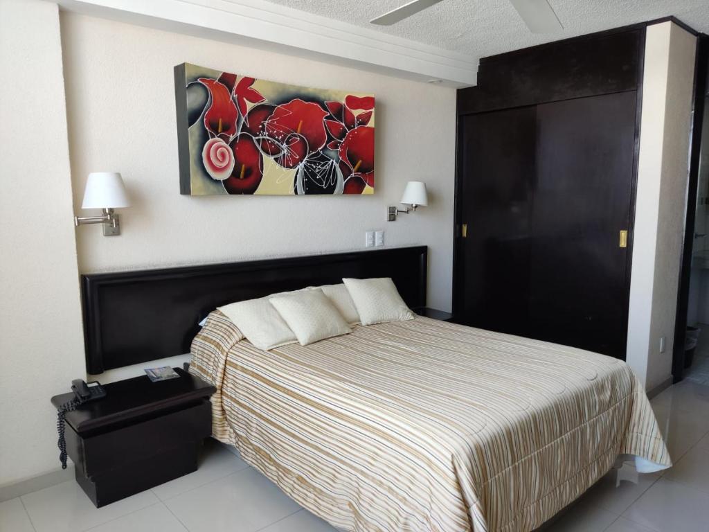 Postel nebo postele na pokoji v ubytování Hotel Mary Celaya