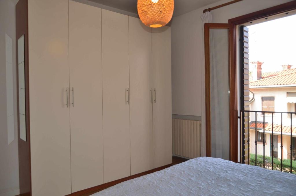 Łóżko lub łóżka w pokoju w obiekcie Montello Apartment Noale