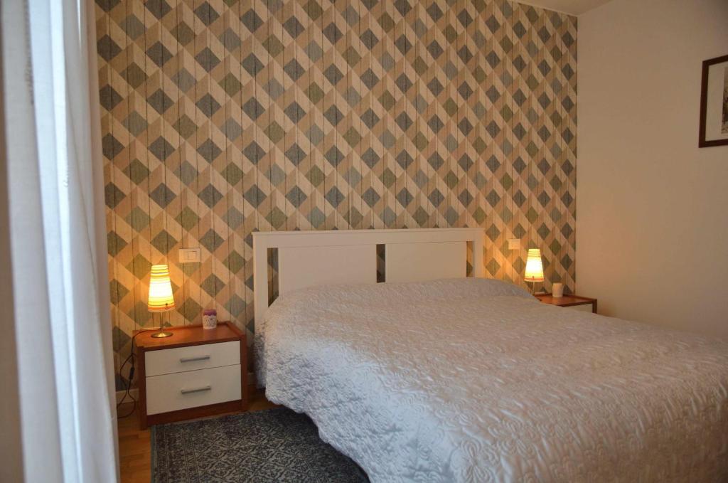 Łóżko lub łóżka w pokoju w obiekcie Montello Apartment Noale