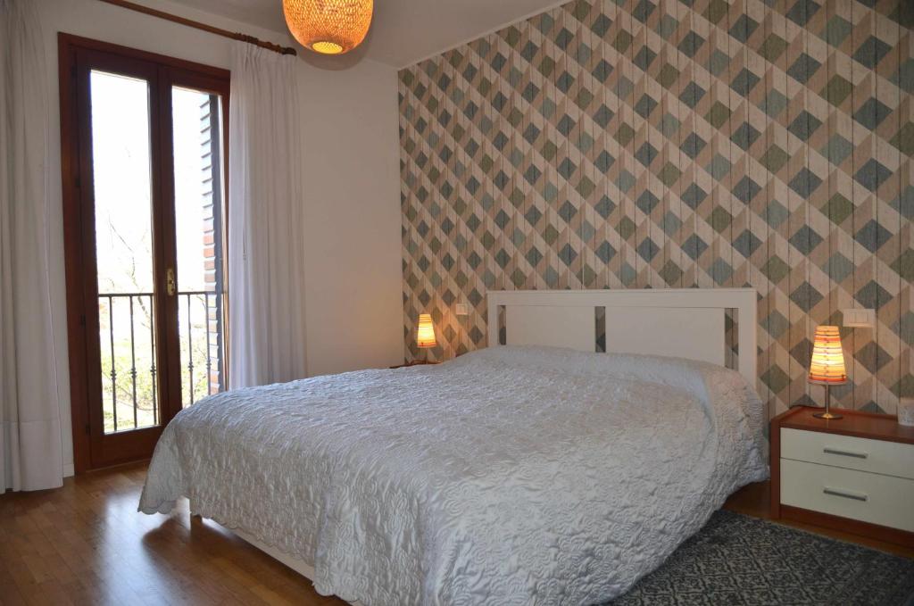 Łóżko lub łóżka w pokoju w obiekcie Montello Apartment Noale