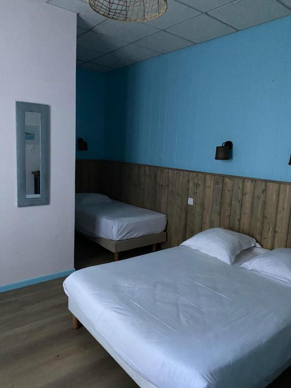 Postel nebo postele na pokoji v ubytování Hotel Le Colibri