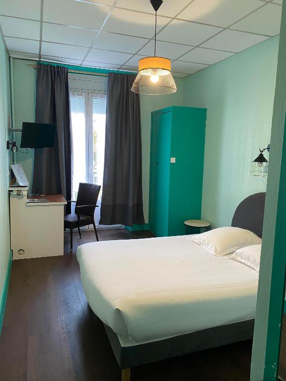 Postel nebo postele na pokoji v ubytování Hotel Le Colibri