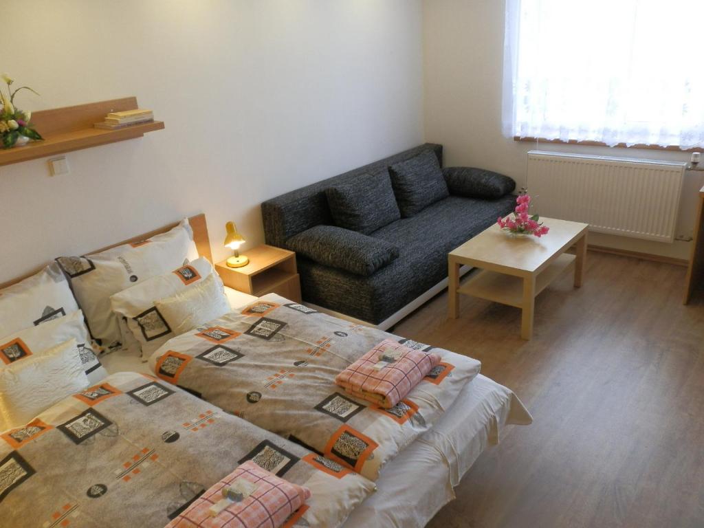 Posteľ alebo postele v izbe v ubytovaní Hotel Gól Prostějov