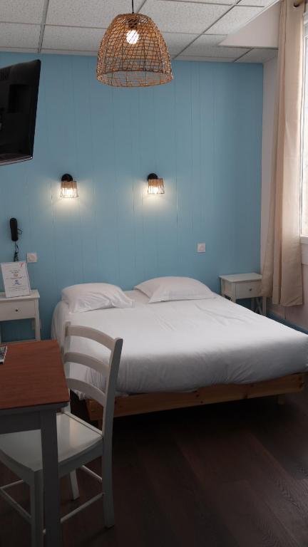 Postel nebo postele na pokoji v ubytování Hotel Le Colibri